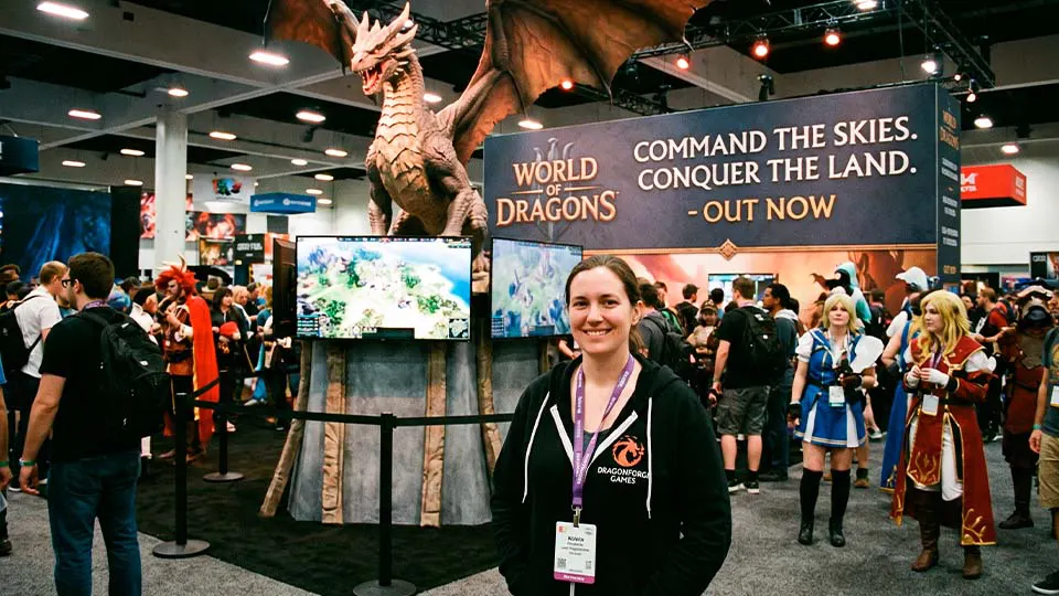 Зайферт Злата рекламный стенд игры World of Dragons на выставке Е3